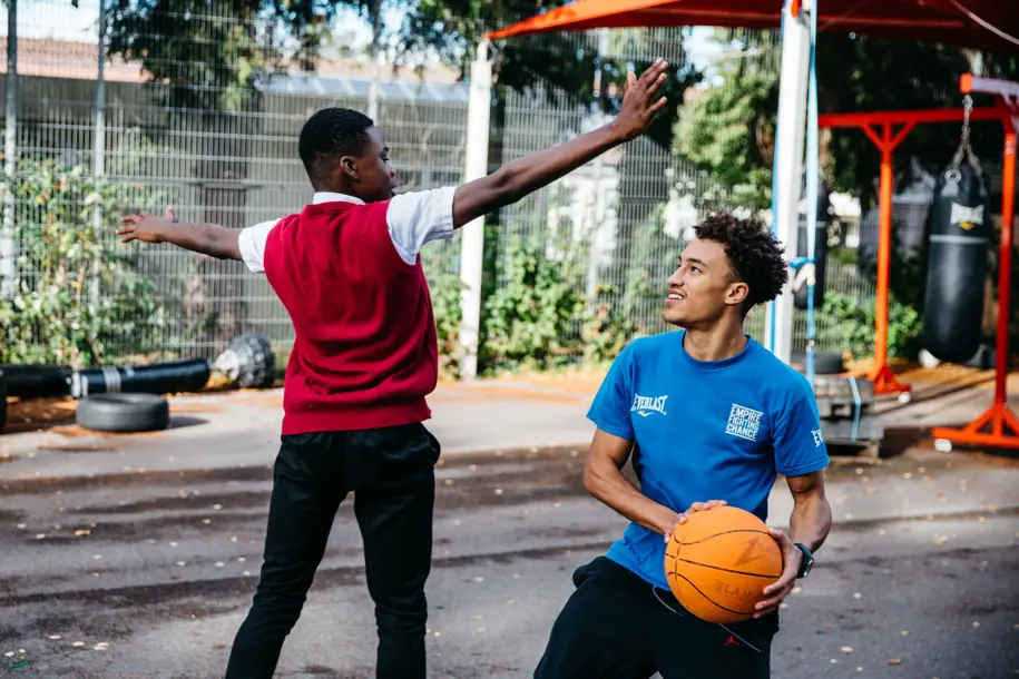 Young Person And Empire Coach Playing Basketball